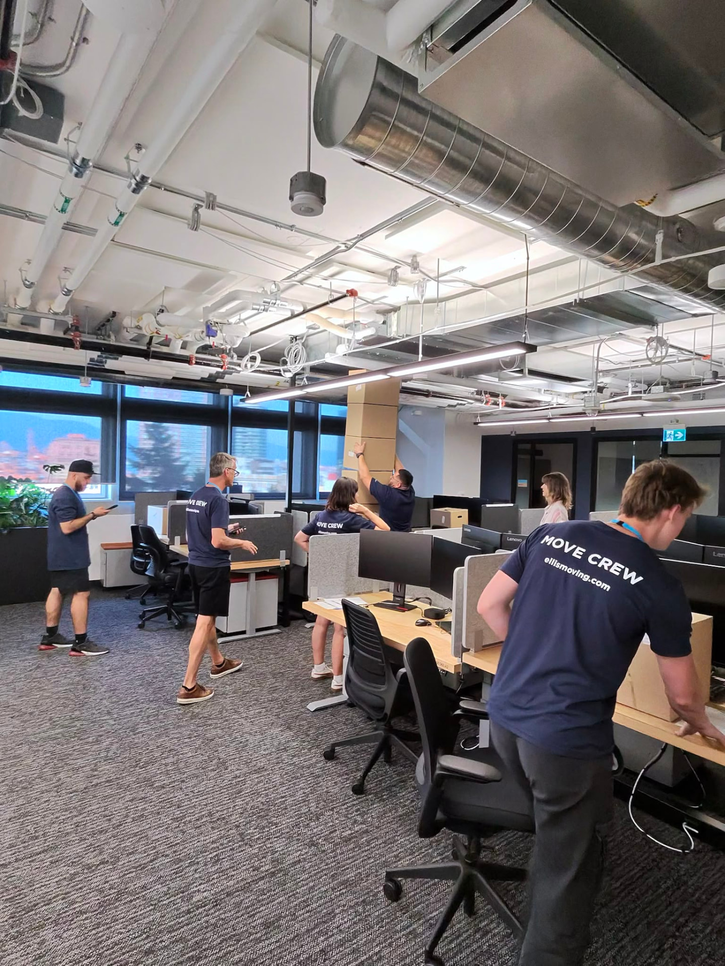 Ellis move crew packing desks and monitors during a North Vancouver office move